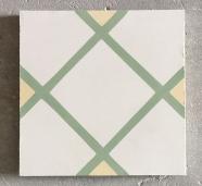 Mosáico hidráulico con un conjunto de cuadros pequeños en verde, amarillo y blanco