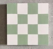 Losa hidráulica con forma de tablero de ajedrez verde y blanco
