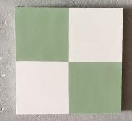 baldosa geométrica con cuatro cuadrados en verde y blanco